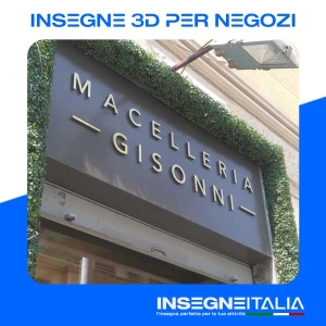 Insegna 3D metallica, in rilievo, riportante la scritta MACELLERIA GISONNI, di colore oro su marrone