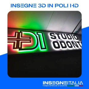 Insegna in 3d retroilluminata di un logo a luce posteriore verde e rossa e la scritta "studio odontoiatrico" a luce posteriore bianca